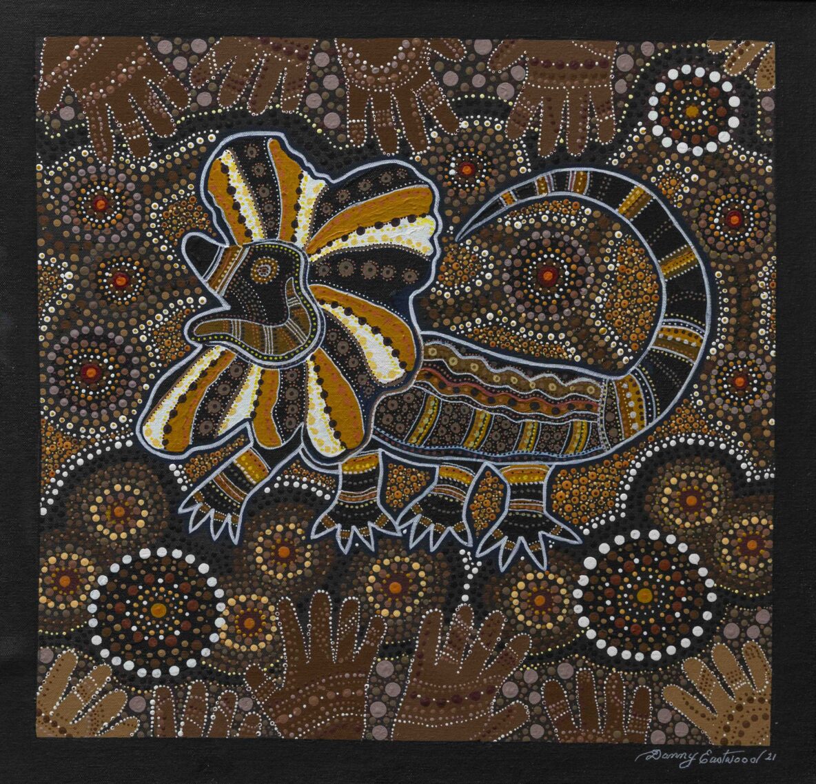 Australian dot-painting style artwork with brown, black and orange dotted swirls and a large yellow-orange petal motif outlined in white; signature 'Danny Eastwood 21'