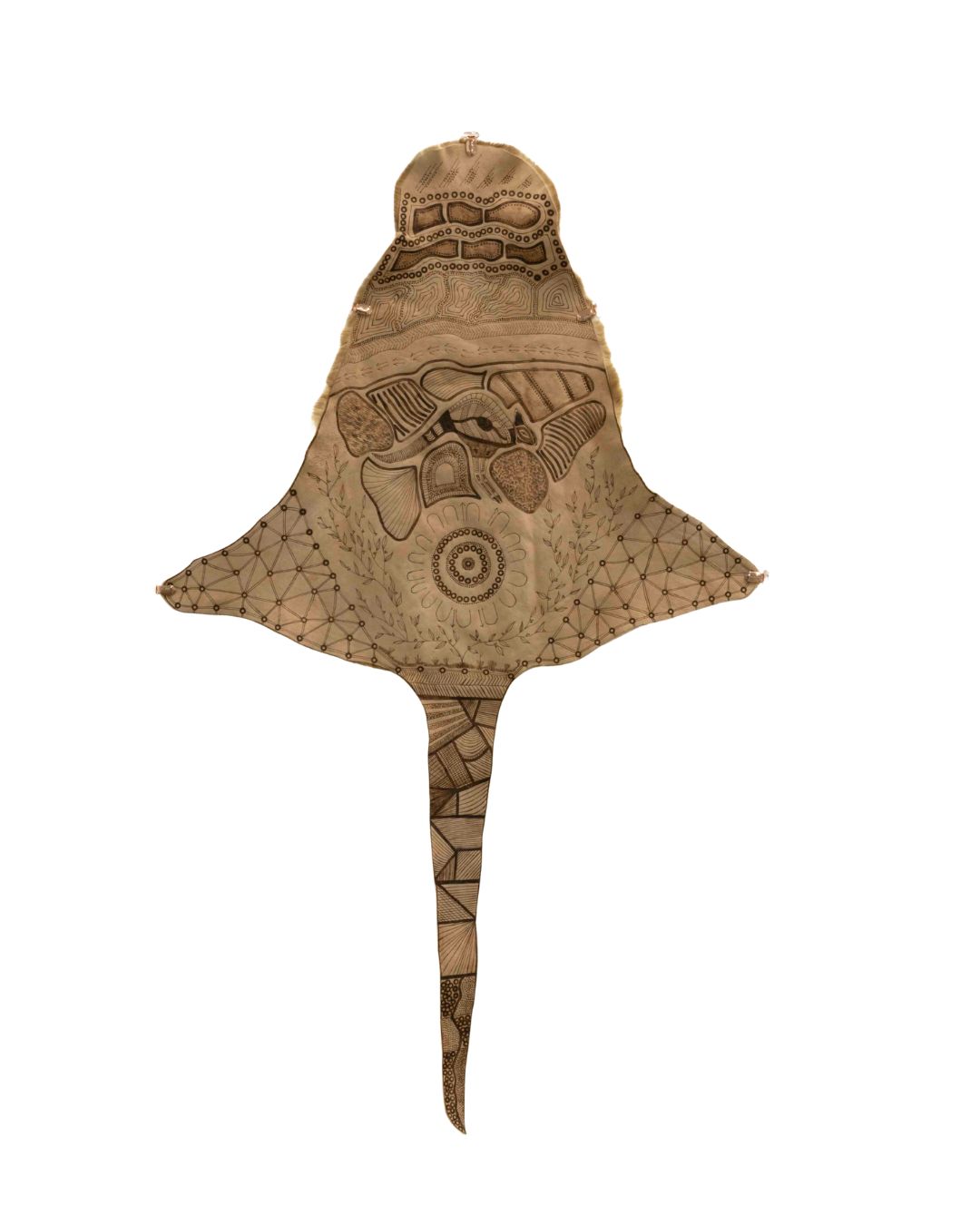 Stingray-shaped decorative paper kite with intricate geometric and tribal patterns in brown tones